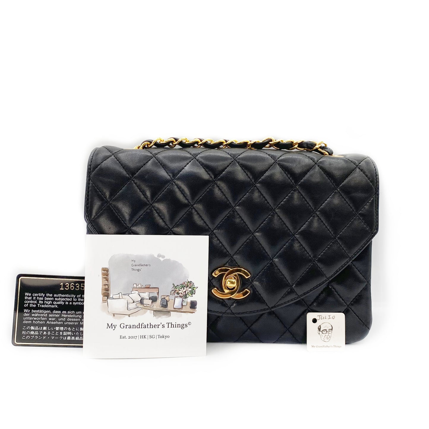 Julio, Vintage Authentic Chanel 1 series matelasse half moon chain black lambskin with seal and card