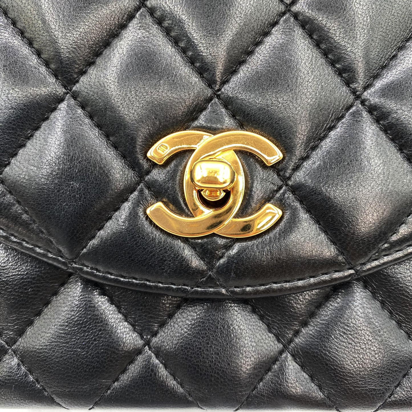Julio, Vintage Authentic Chanel 1 series matelasse half moon chain black lambskin with seal and card