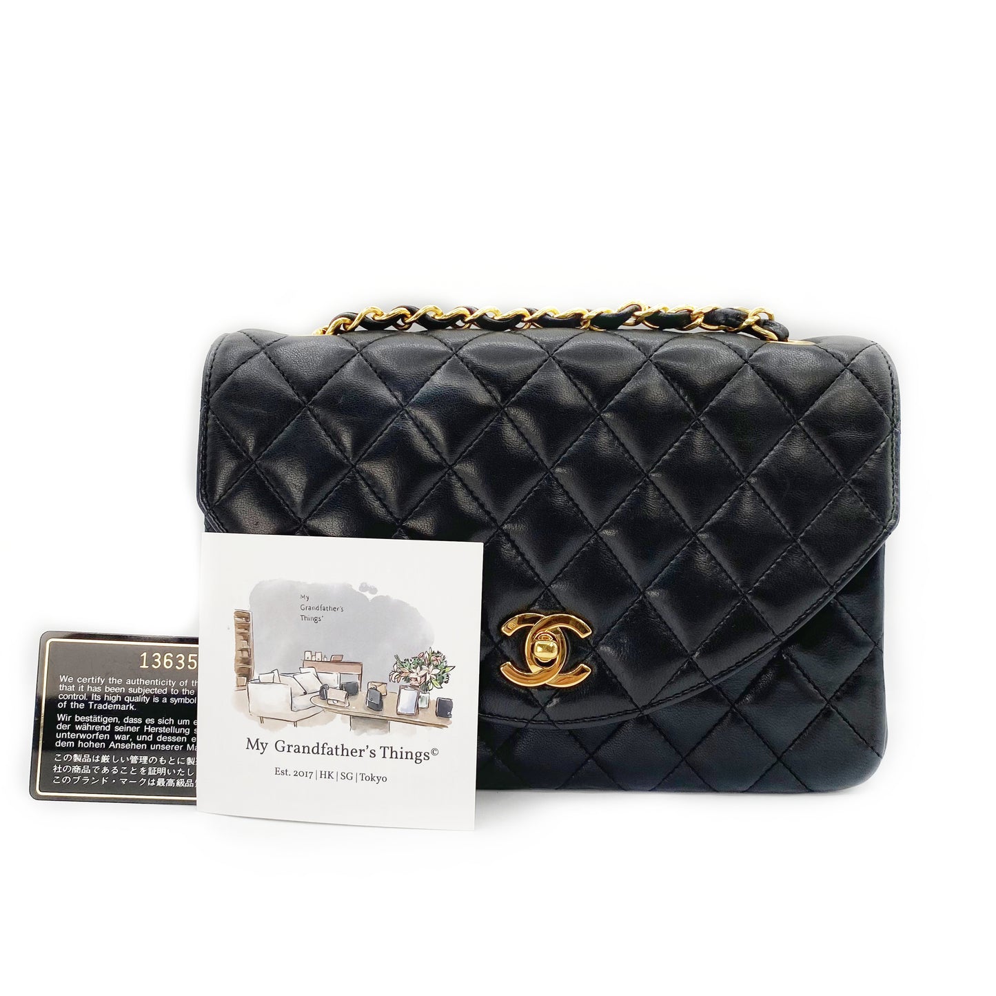 Julio, Vintage Authentic Chanel 1 series matelasse half moon chain black lambskin with seal and card