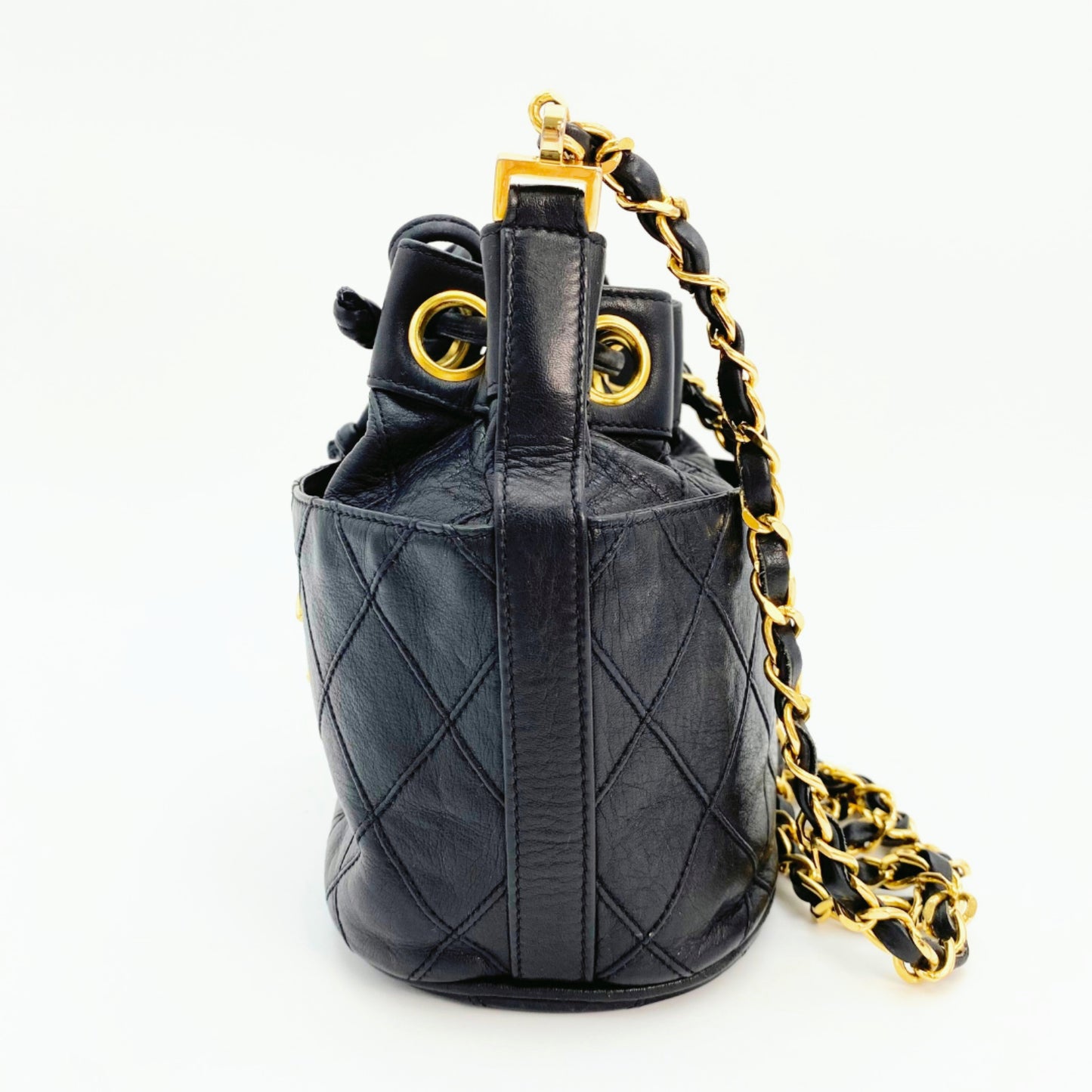 Rylie, Vintage Authentic Chanel 0 series drawstring mini black lambskin with seal