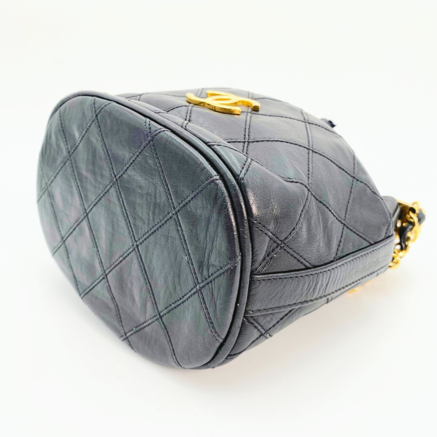 Rylie, Vintage Authentic Chanel 0 series drawstring mini black lambskin with seal