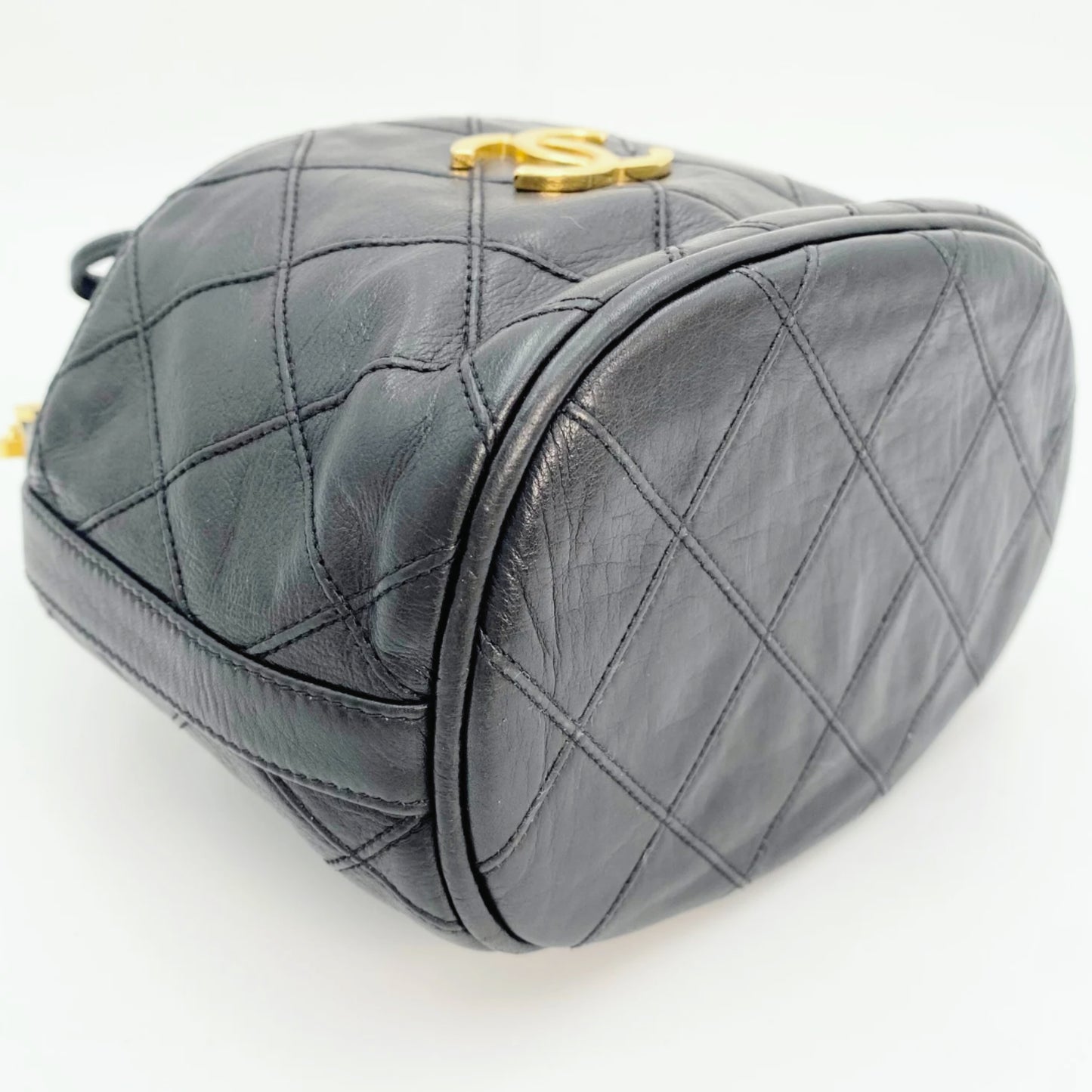 Rylie, Vintage Authentic Chanel 0 series drawstring mini black lambskin with seal
