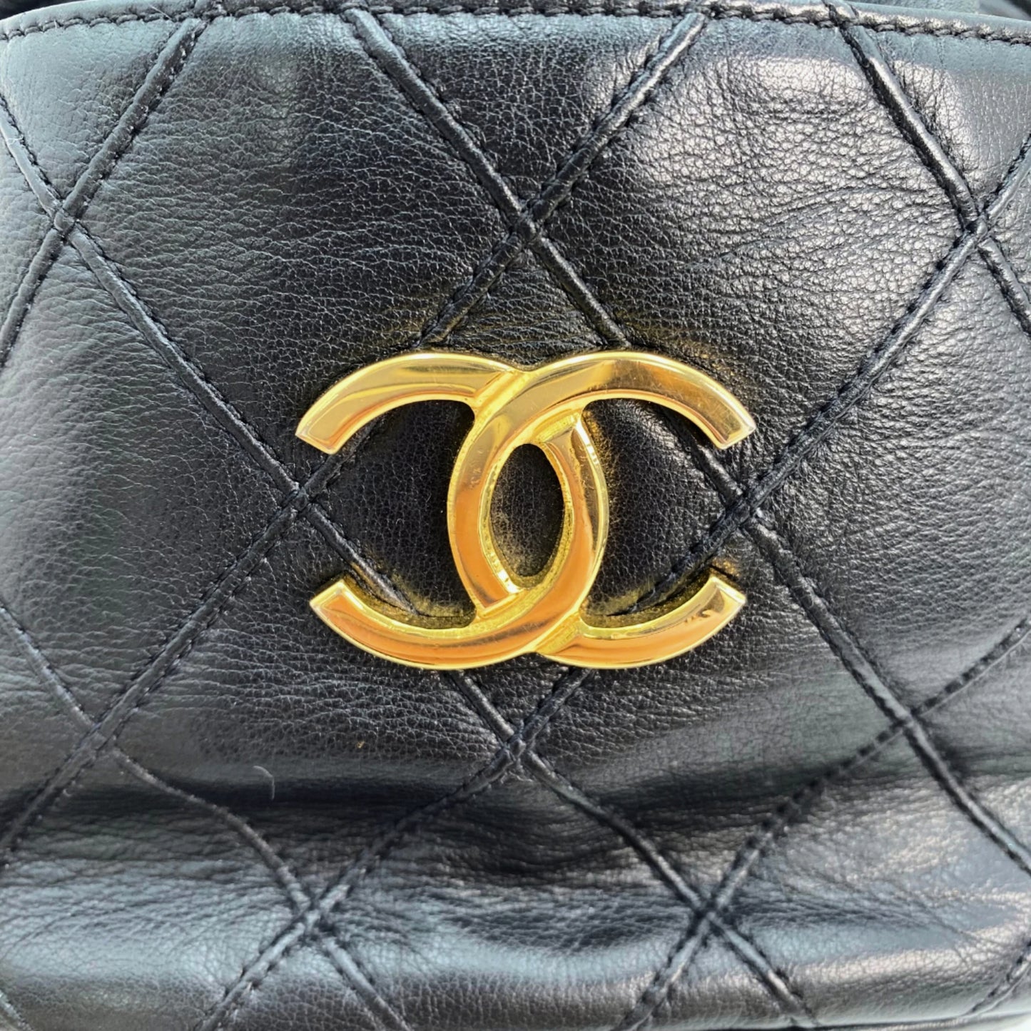 Rylie, Vintage Authentic Chanel 0 series drawstring mini black lambskin with seal