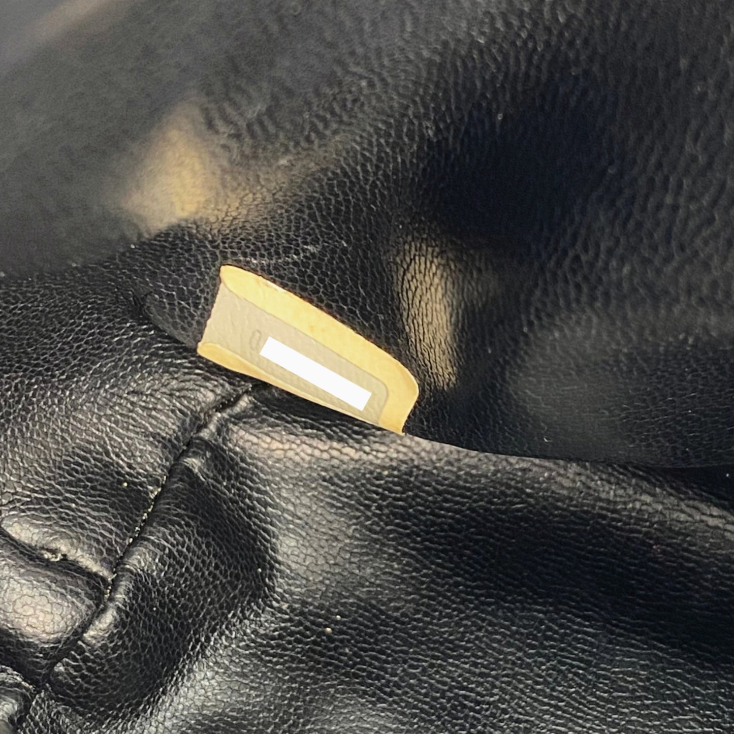 Rylie, Vintage Authentic Chanel 0 series drawstring mini black lambskin with seal