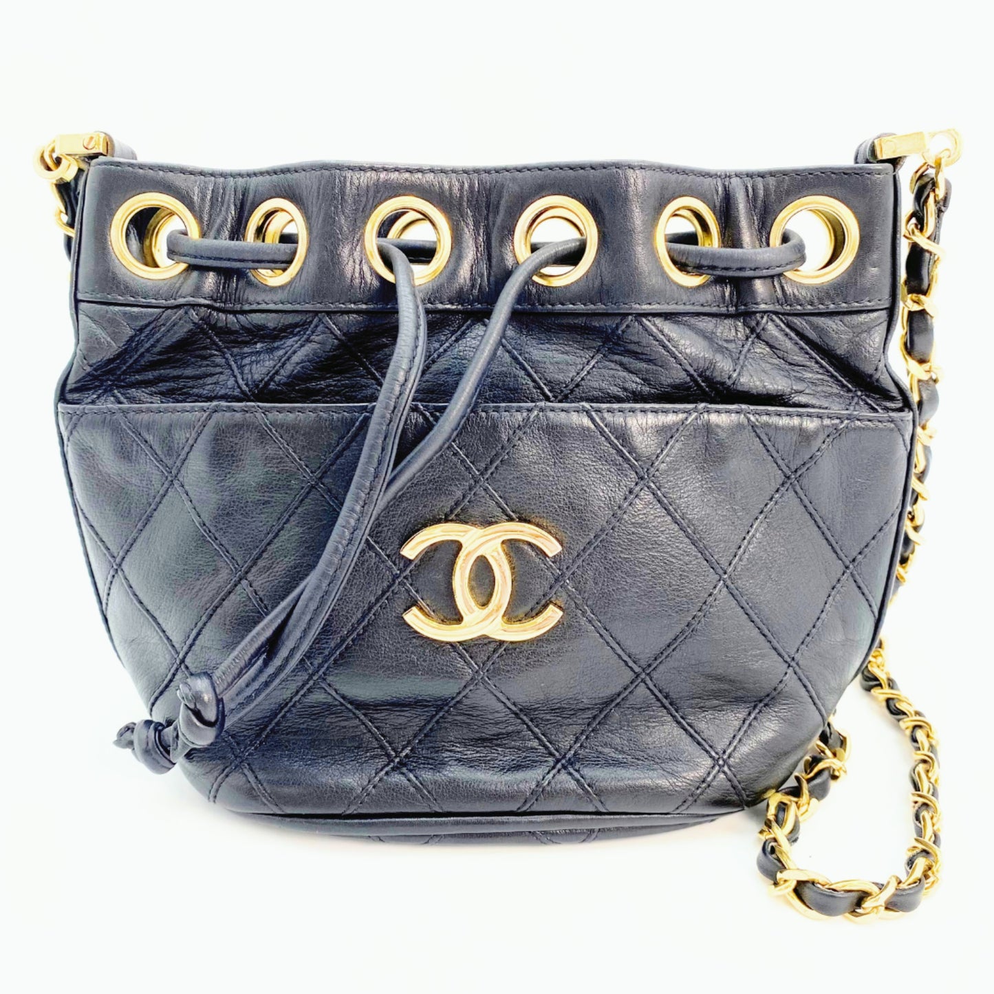 Rylie, Vintage Authentic Chanel 0 series drawstring mini black lambskin with seal