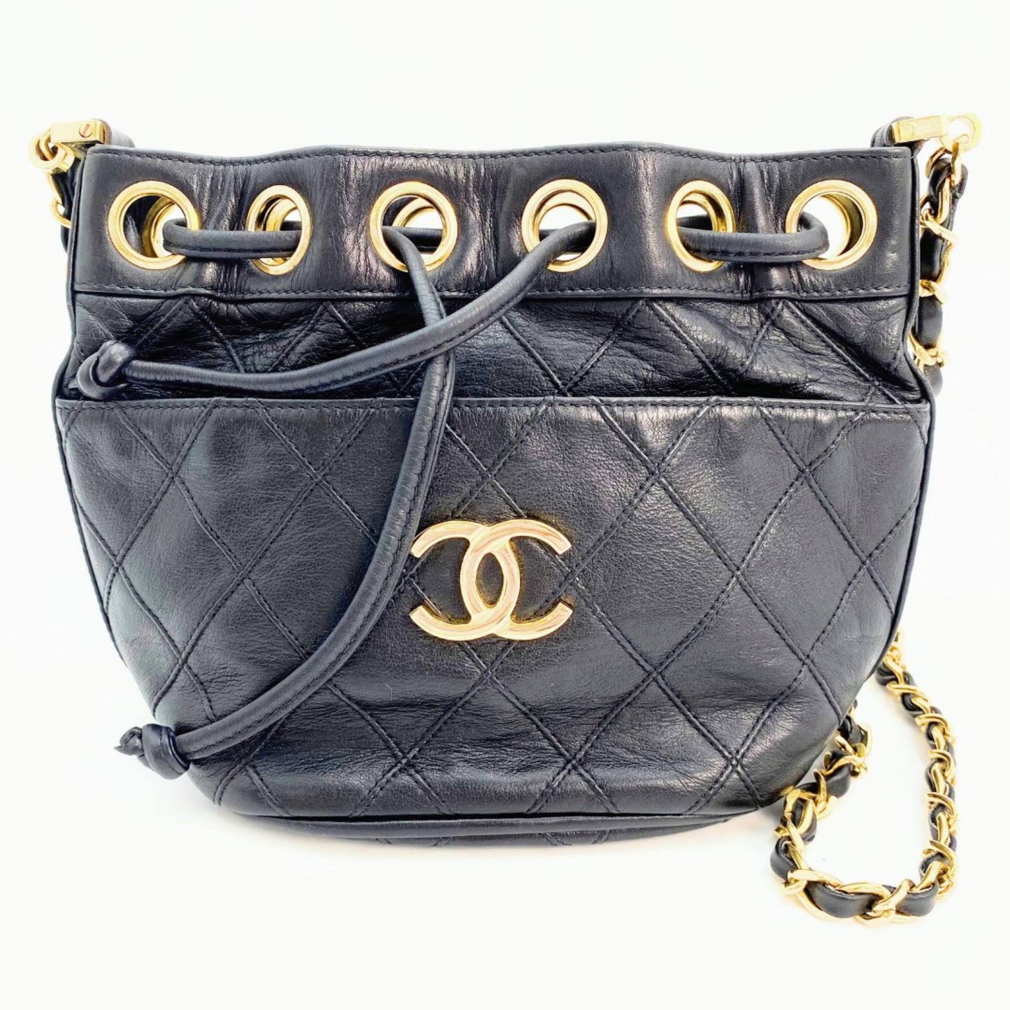 Rylie, Vintage Authentic Chanel 0 series drawstring mini black lambskin with seal