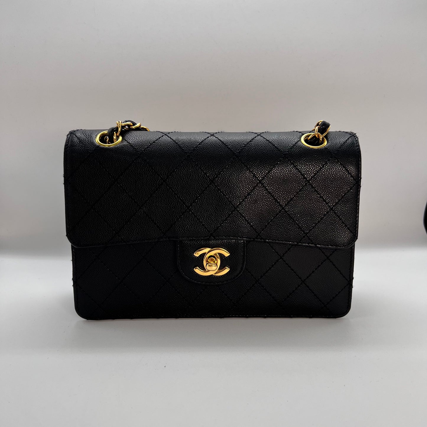 Cathy, Vintage Authentic Chanel 5 series chain wild stitch flap in black caviar with seal and card