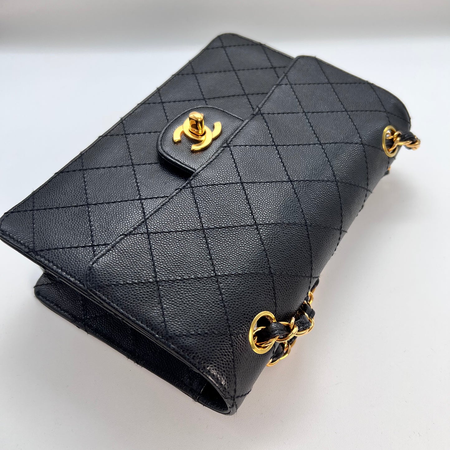 Cathy, Vintage Authentic Chanel 5 series chain wild stitch flap in black caviar with seal and card
