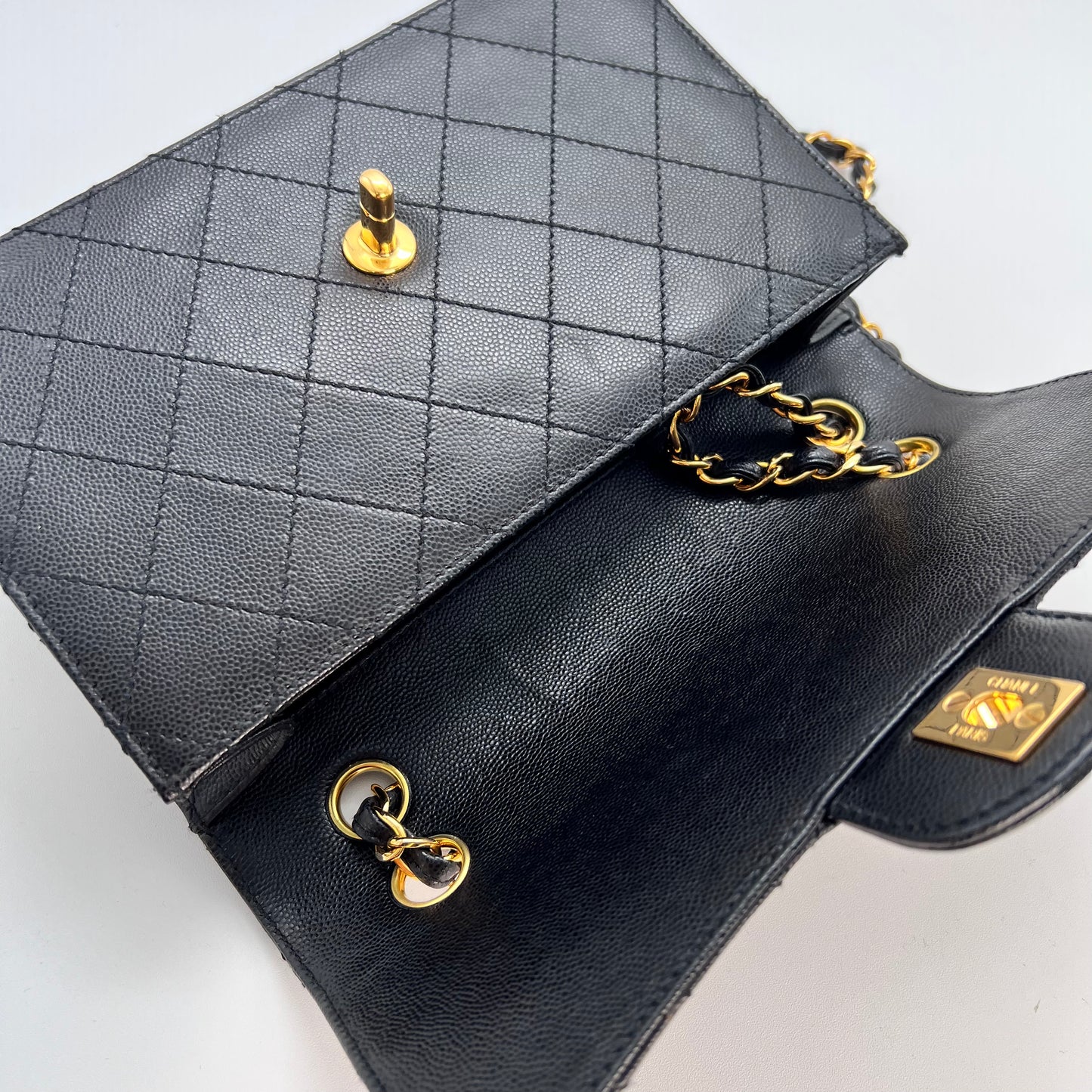 Cathy, Vintage Authentic Chanel 5 series chain wild stitch flap in black caviar with seal and card