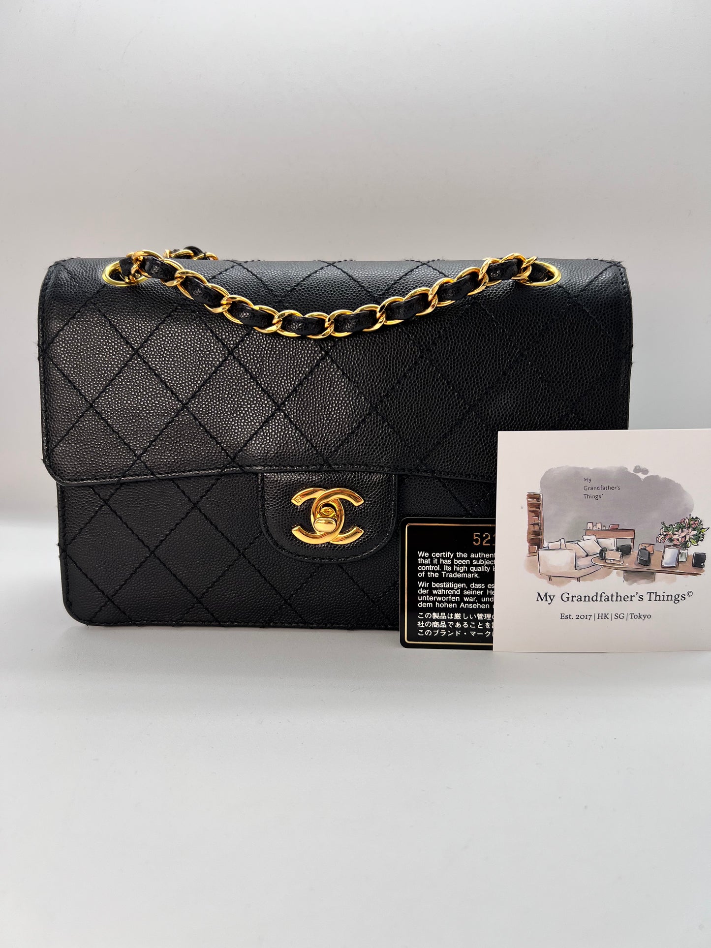 Cathy, Vintage Authentic Chanel 5 series chain wild stitch flap in black caviar with seal and card