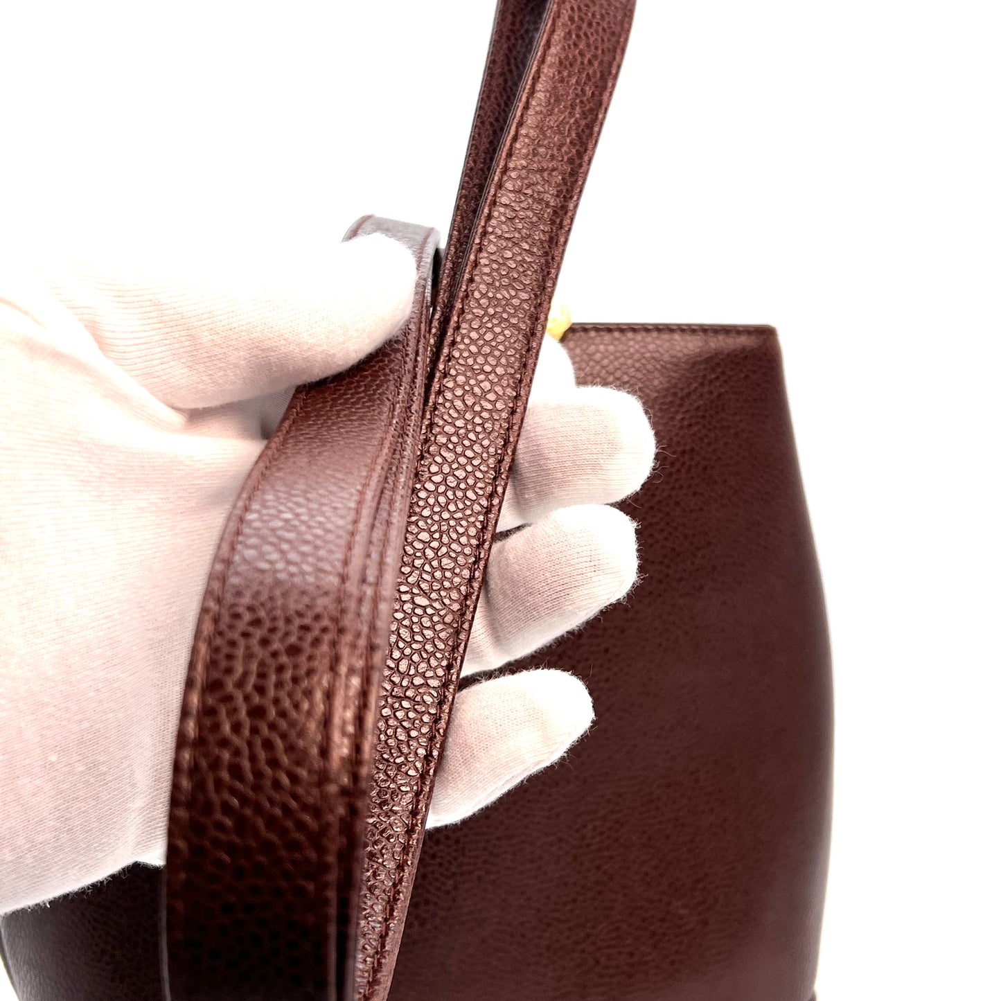 Tripp, 3 Series Brown caviar bucket bag with seal and card