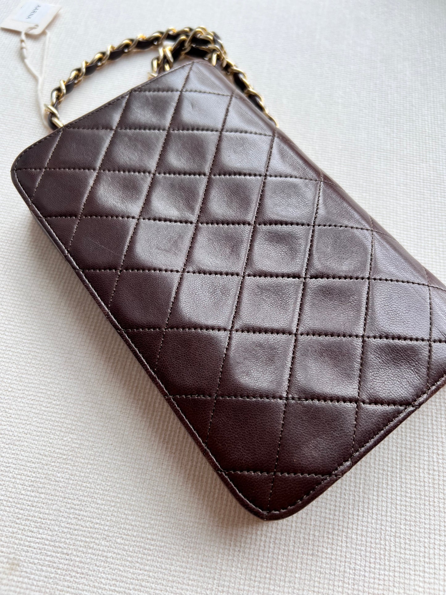 Aarna, Vintage Chanel 1 series brown lambskin clutch on chain with seal only