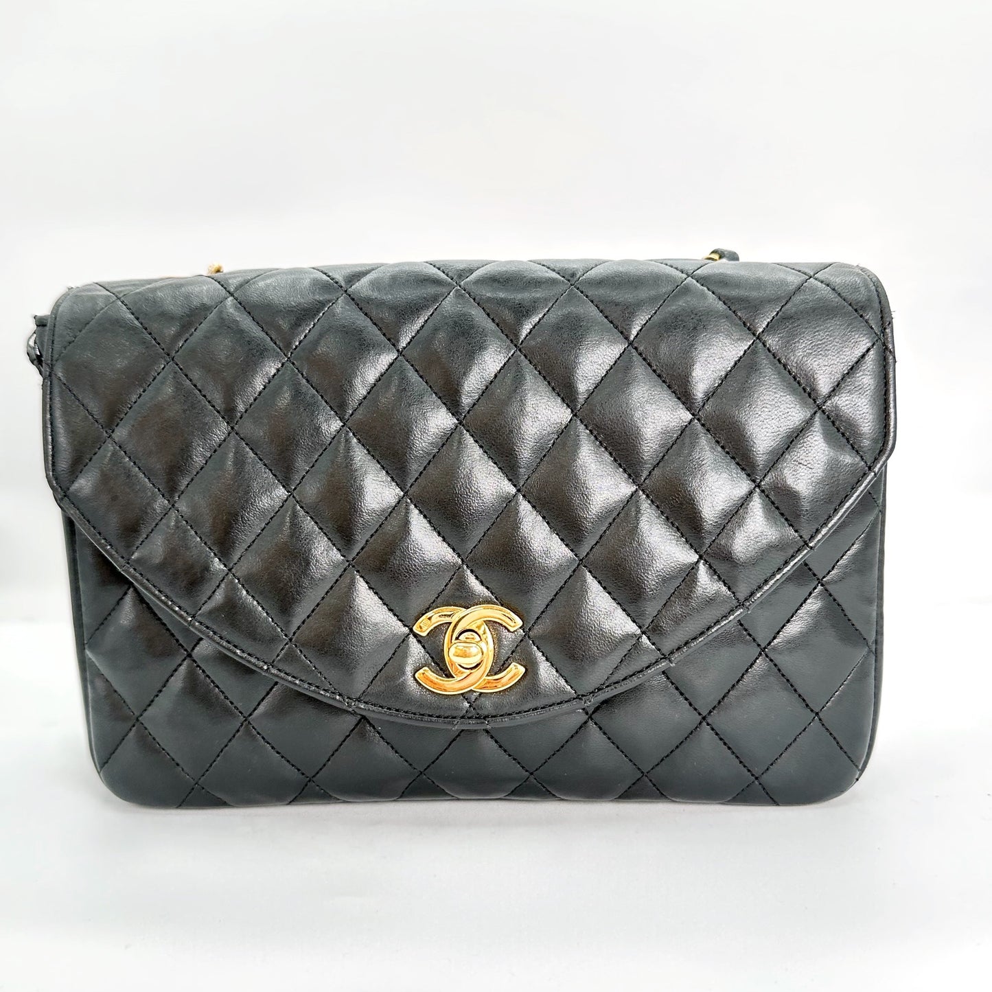 Sylvia, Vintage Authentic Chanel 0 series half moon chain black lambskin with seal