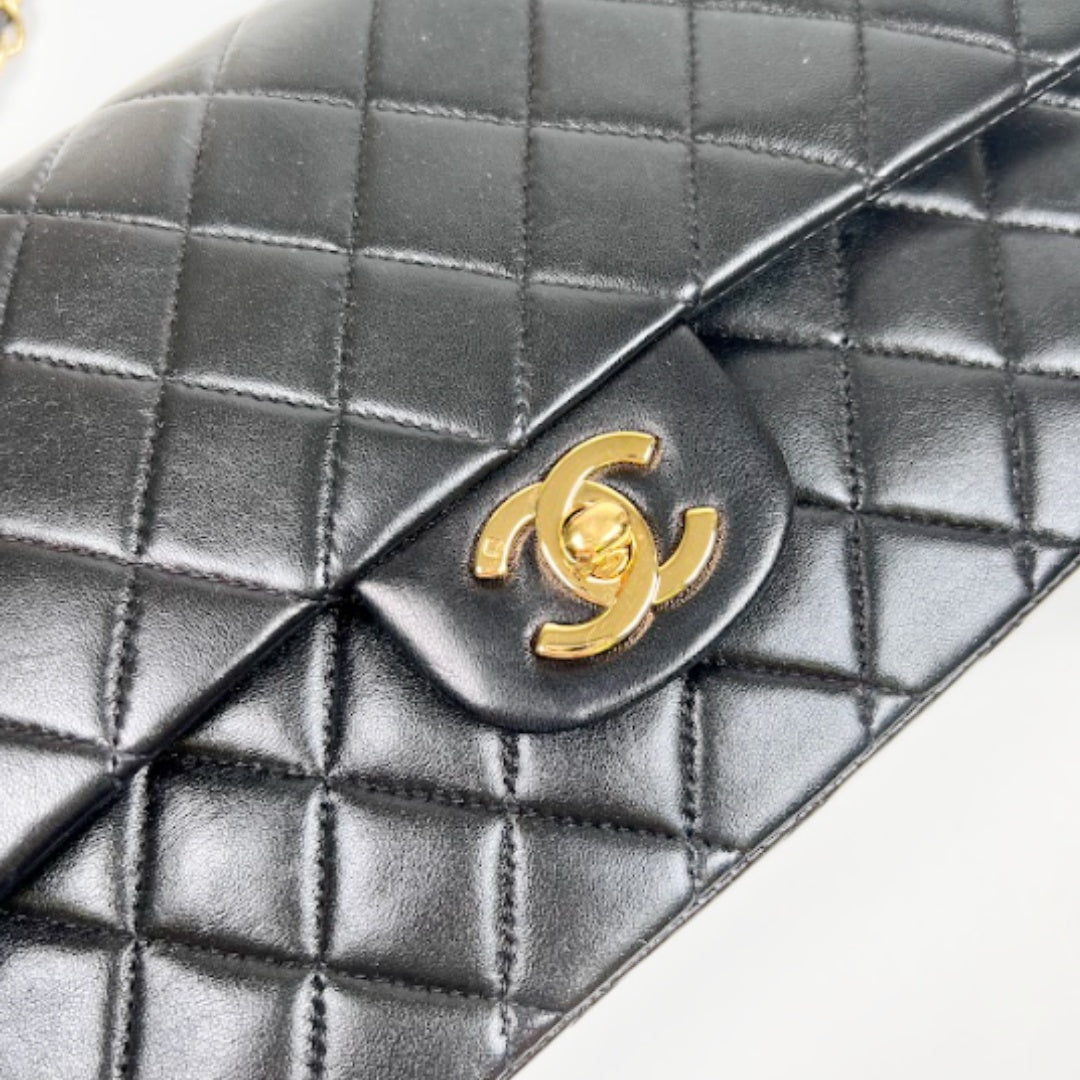 Ingrid, Vintage Authentic Chanel 6 series medium classic flap black lambskin with seal and card