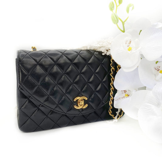 Julio, Vintage Authentic Chanel 1 series matelasse half moon chain black lambskin with seal and card