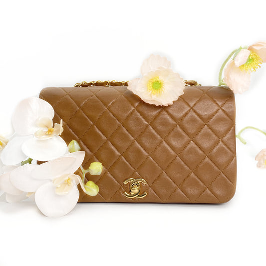Reece Jr, Vintage Authentic Chanel 1 series full flap chain brown lambskin with seal and card