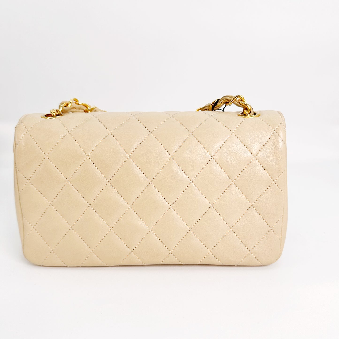 Eiko, Vintage Authentic Chanel 1 series mini matelasse beige lambskin with seal