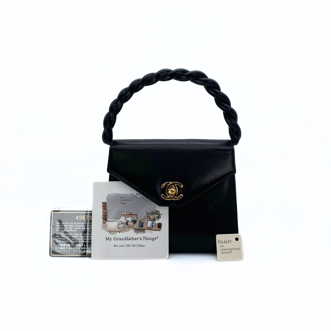 Makoto, 4 Series Turnlock Black Lambskin with seal and card