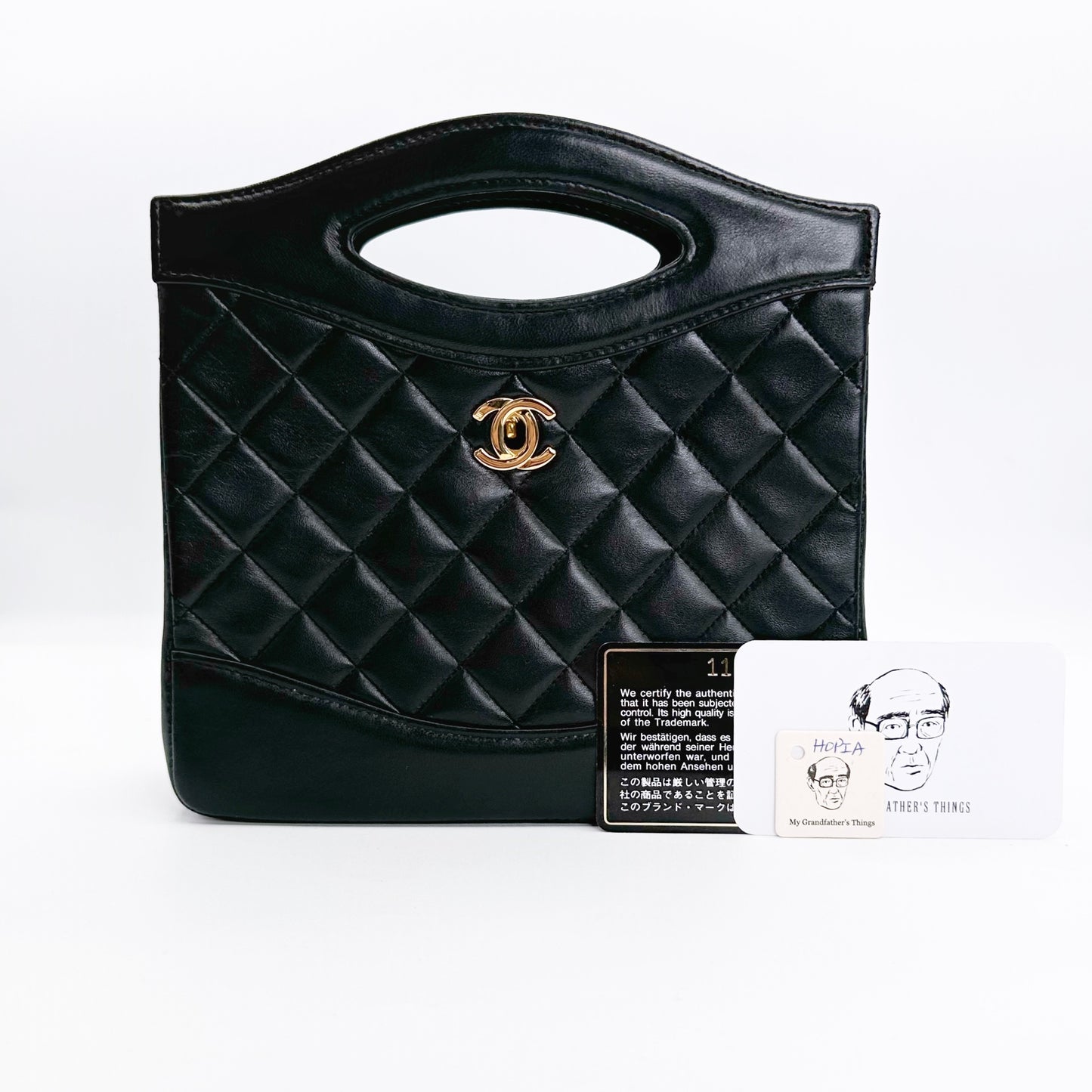 Hopia, Vintage Authentic Chanel 1 series mini 31 black lambskin with seal and card