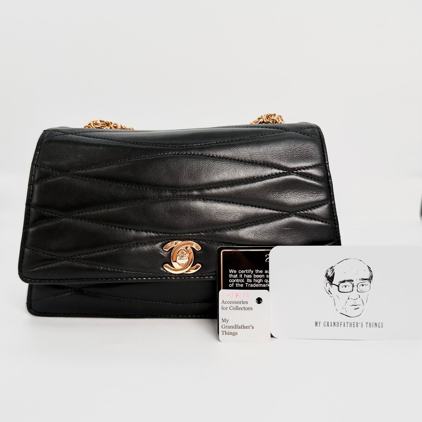 Chizue, Vintage Authentic Chanel 2 series wave stitch black lambskin with seal and card