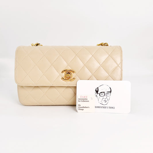 Eiko, Vintage Authentic Chanel 1 series mini matelasse beige lambskin with seal