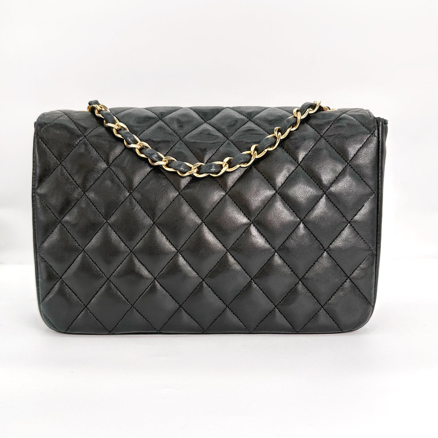 Sylvia, Vintage Authentic Chanel 0 series half moon chain black lambskin with seal