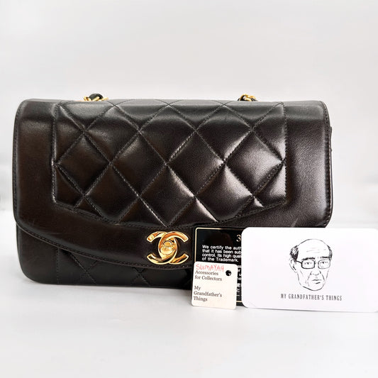 Sumayah, Vintage Authentic Chanel 3 series small black lambskin diana with seal and card