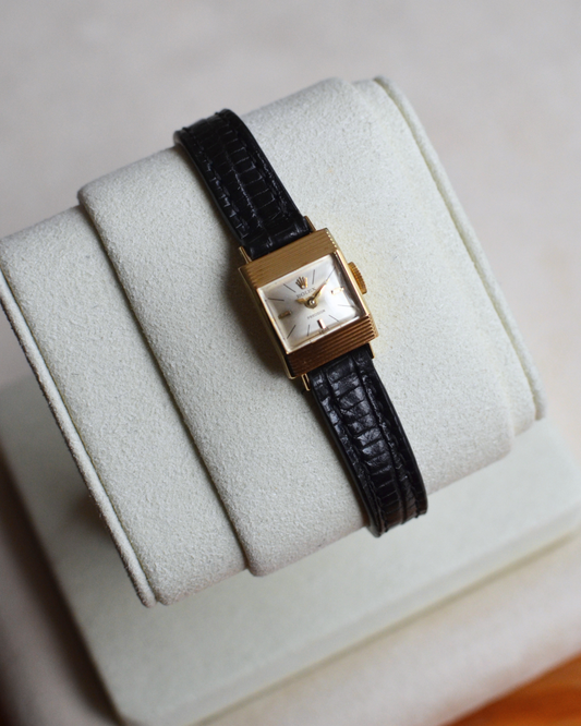 Rolex Precision 18k, step cut case w/ black strap