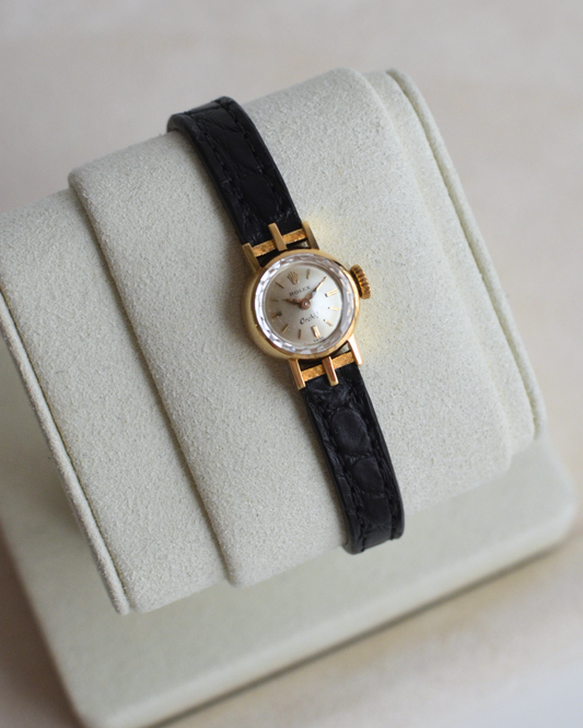 Rolex Orchid 18k, etched lugs w/ black strap