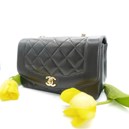 Collins, Vintage Authentic Chanel 2 series small black lambskin diana with seal