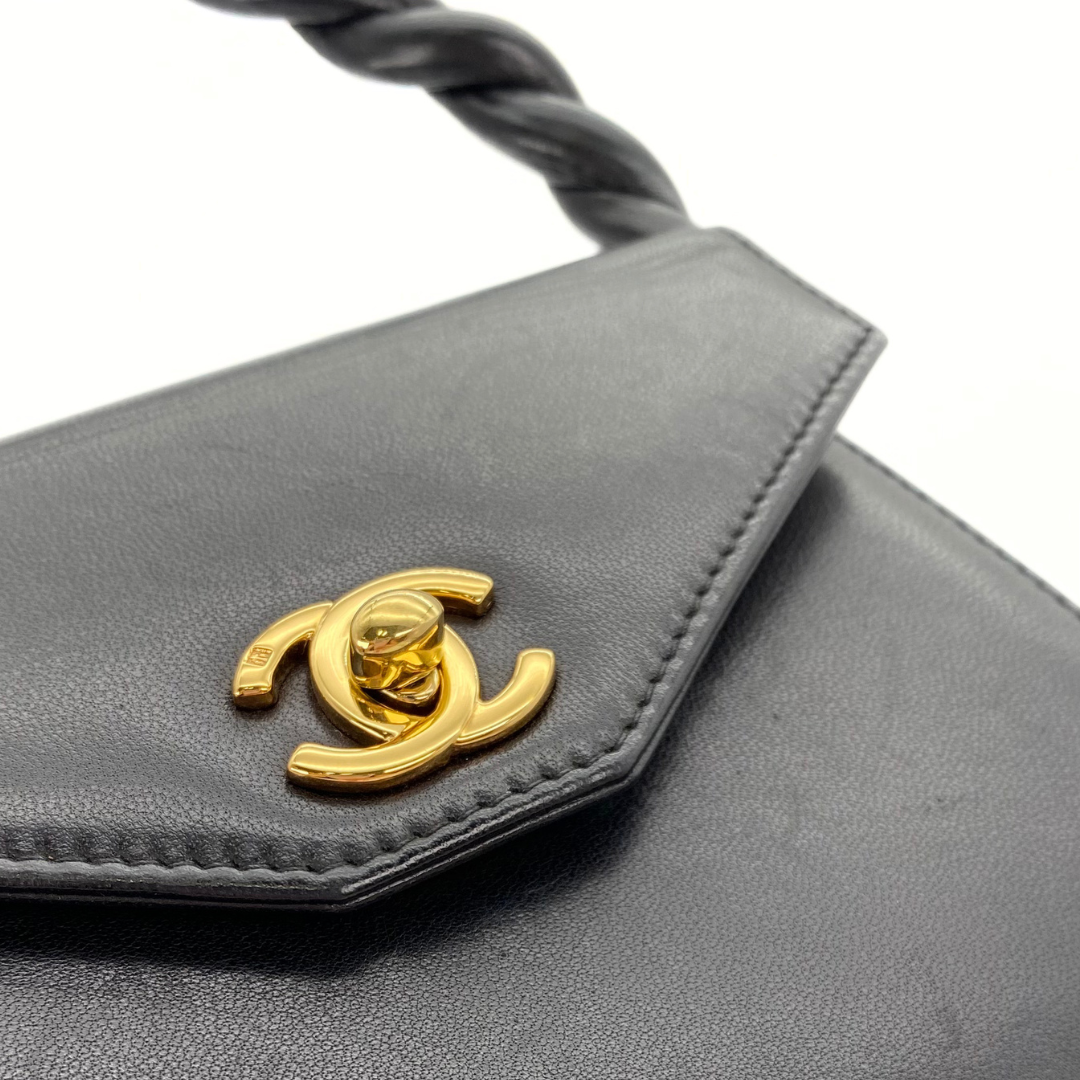 Makoto, 4 Series Turnlock Black Lambskin with seal and card