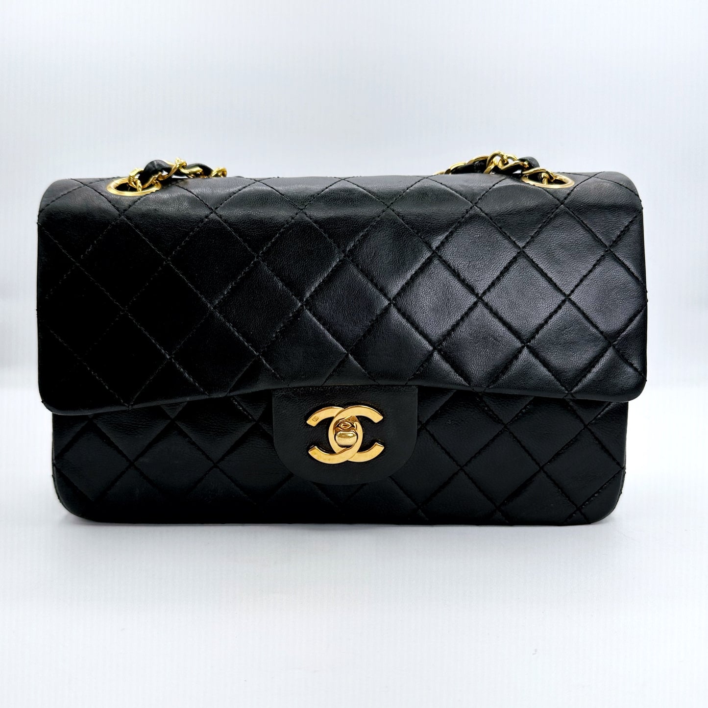 Coleman, Vintage Authentic Chanel 1 series small classic flap black lambskin with seal and card