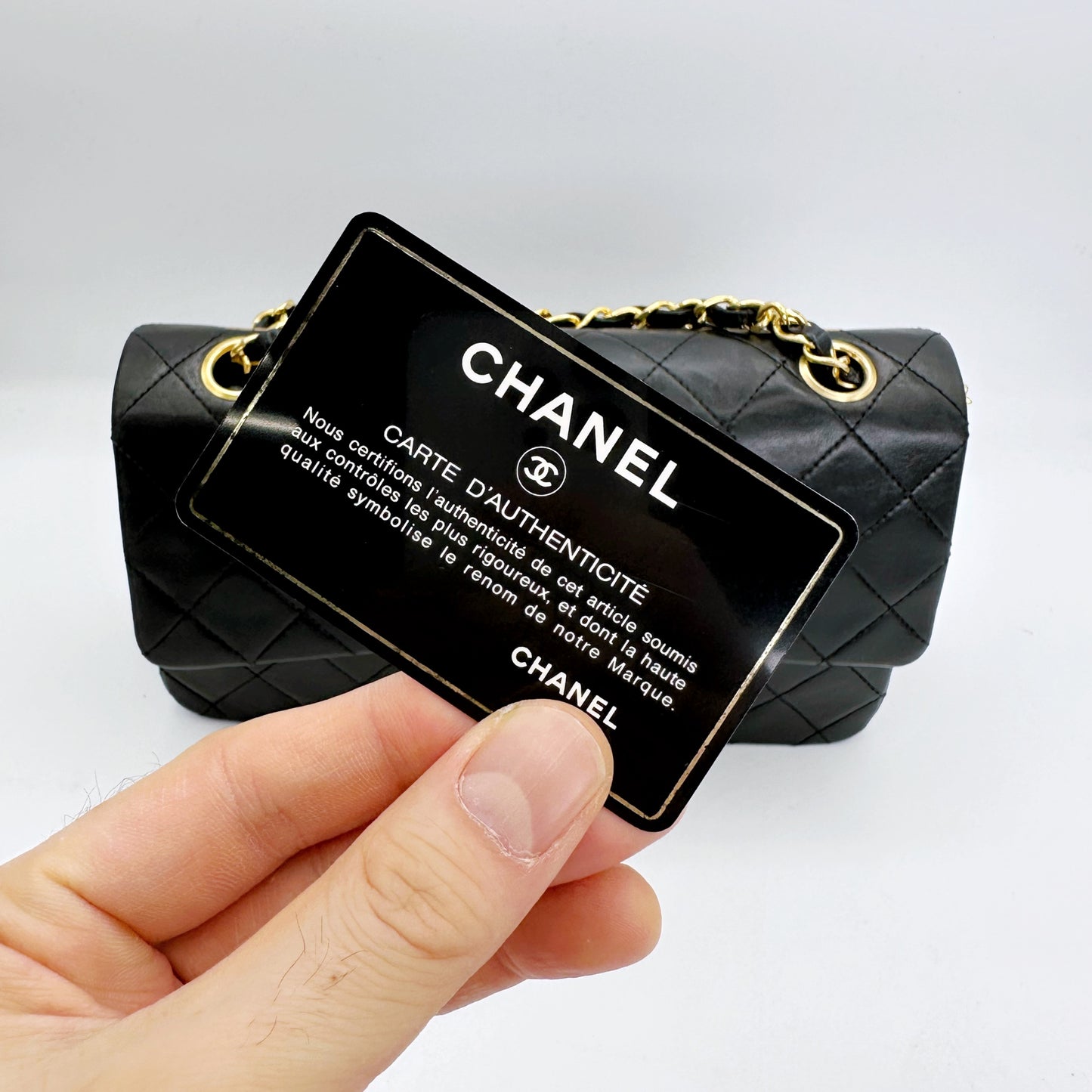 Coleman, Vintage Authentic Chanel 1 series small classic flap black lambskin with seal and card