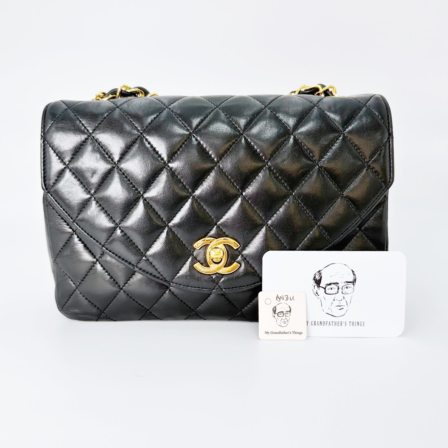 Anzu, Vintage Authentic Chanel 0 series half moon black lambskin with seal