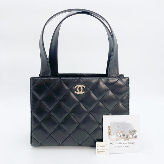 Timothy, Vintage Authentic Chanel 7 series matelasse black lambskin mini tote with seal only