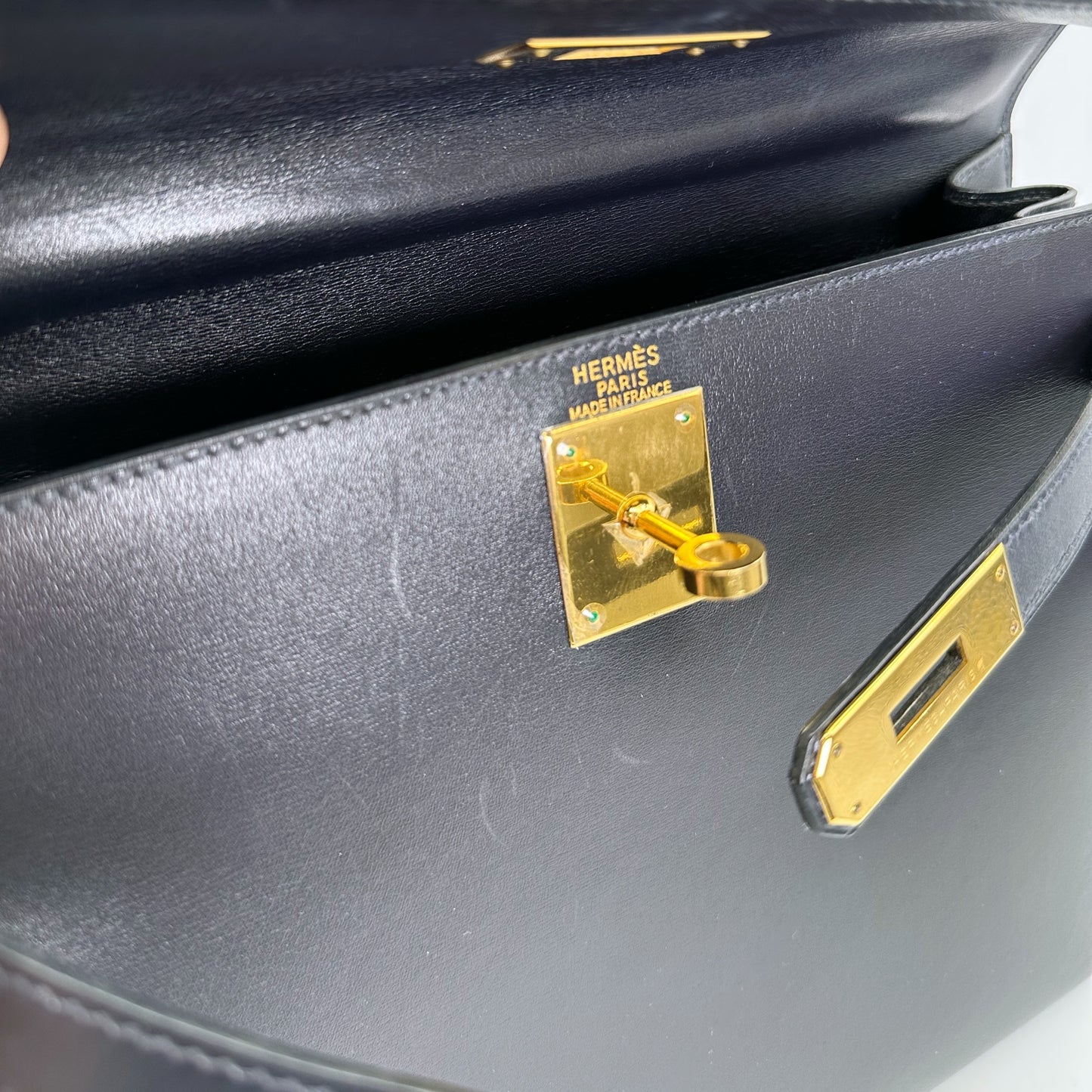 Carmela, Vintage Authentic Hermes 🟥B 1998 kelly 28 sellier stitching navy box GHW with strap, chain, clochette, and key