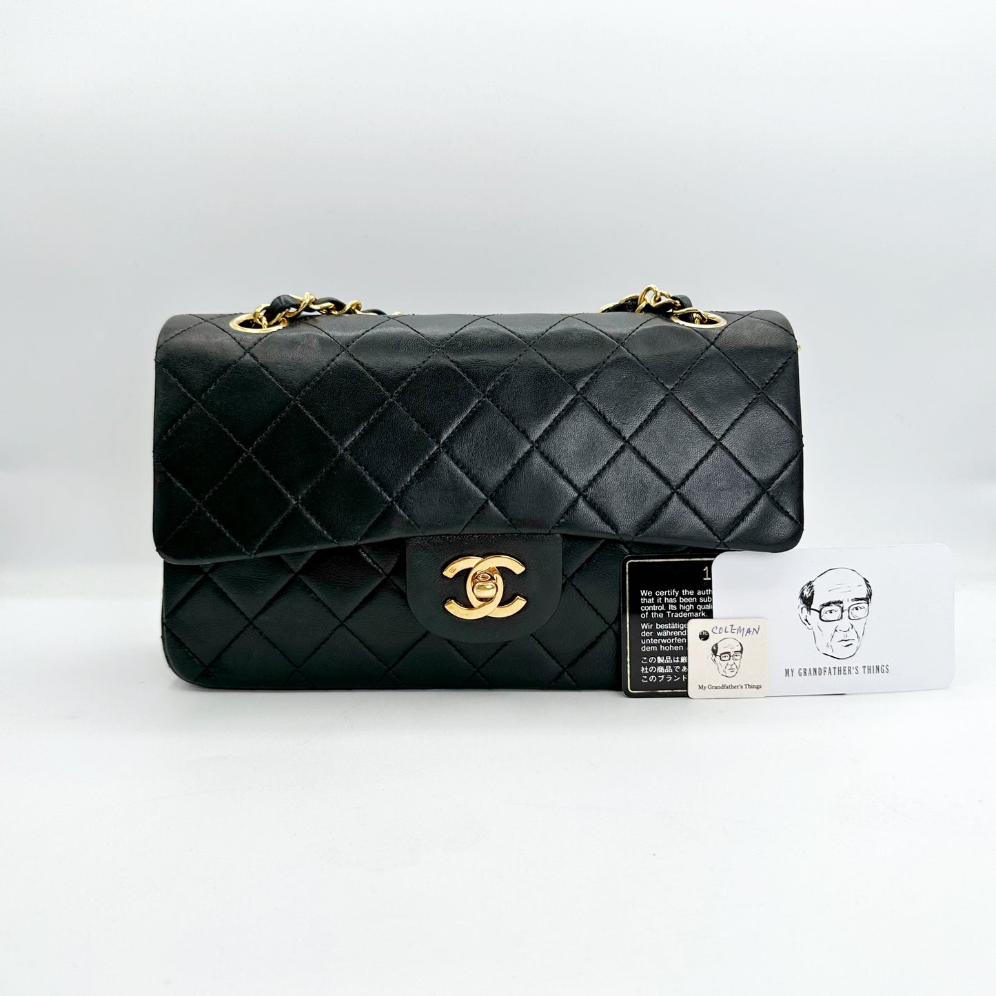 Coleman, Vintage Authentic Chanel 1 series small classic flap black lambskin with seal and card