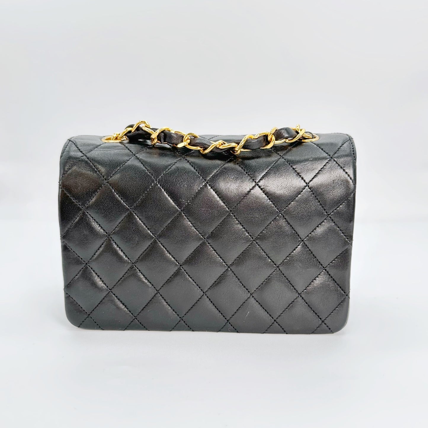 Chinatsu, Vintage Authentic Chanel 1 series mini matelasse black lambskin with seal and card