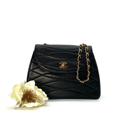 Cortez, 1 series horizontal wave stitch trapezoid black lambskin with seal