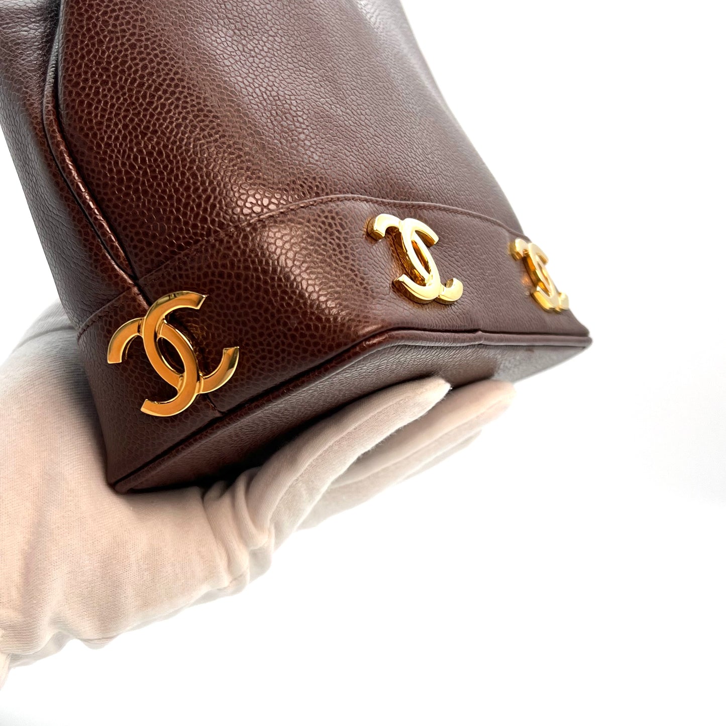 Tripp, 3 Series Brown caviar bucket bag with seal and card