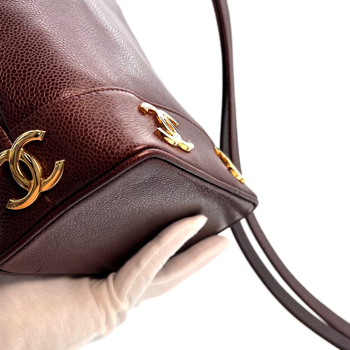 Tripp, 3 Series Brown caviar bucket bag with seal and card