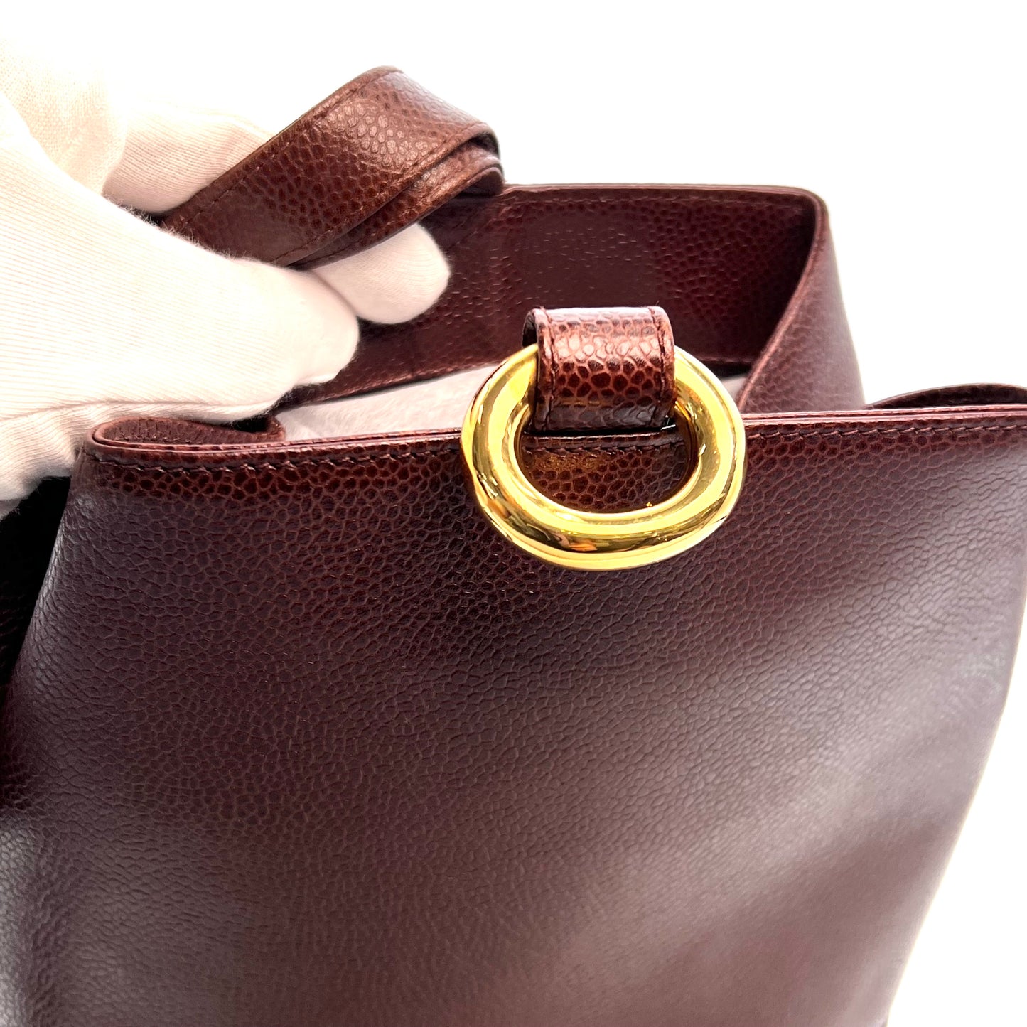 Tripp, 3 Series Brown caviar bucket bag with seal and card