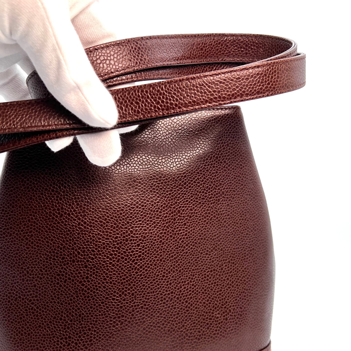 Tripp, 3 Series Brown caviar bucket bag with seal and card