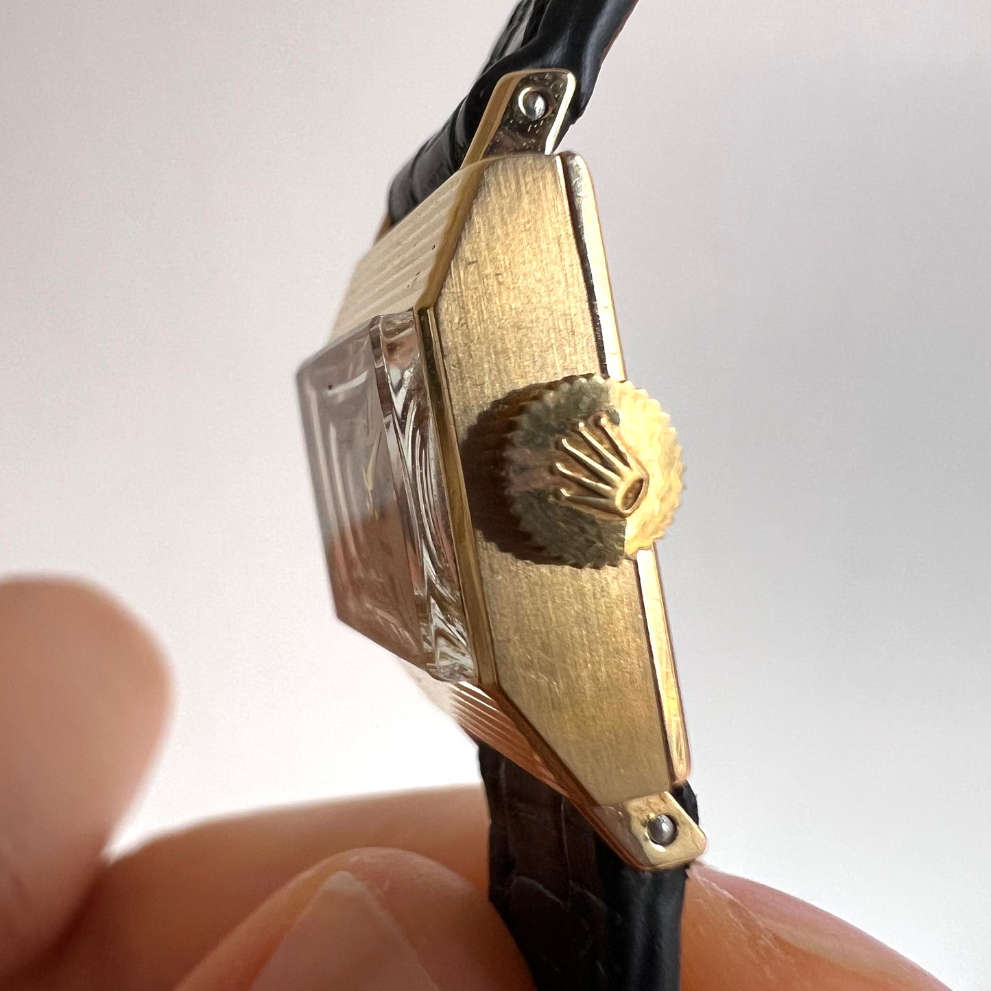 Rolex Precision 18k, step cut case w/ black strap