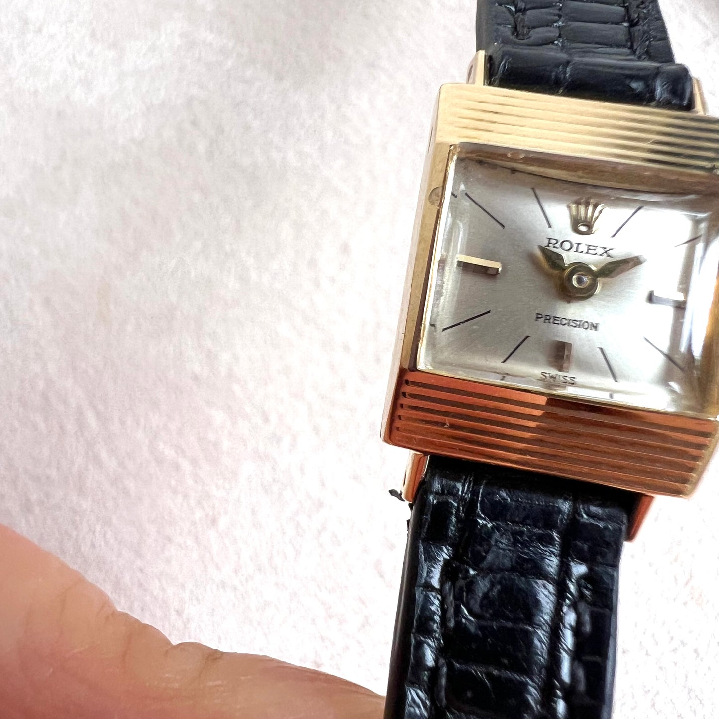 Rolex Precision 18k, step cut case w/ black strap
