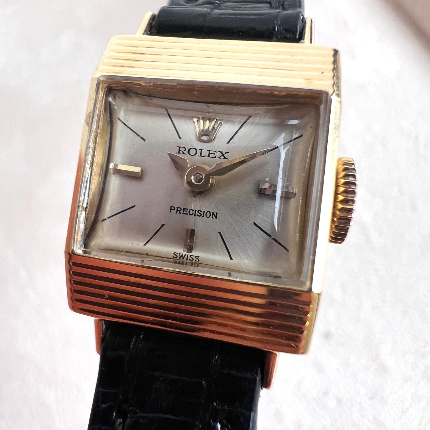 Rolex Precision 18k, step cut case w/ black strap