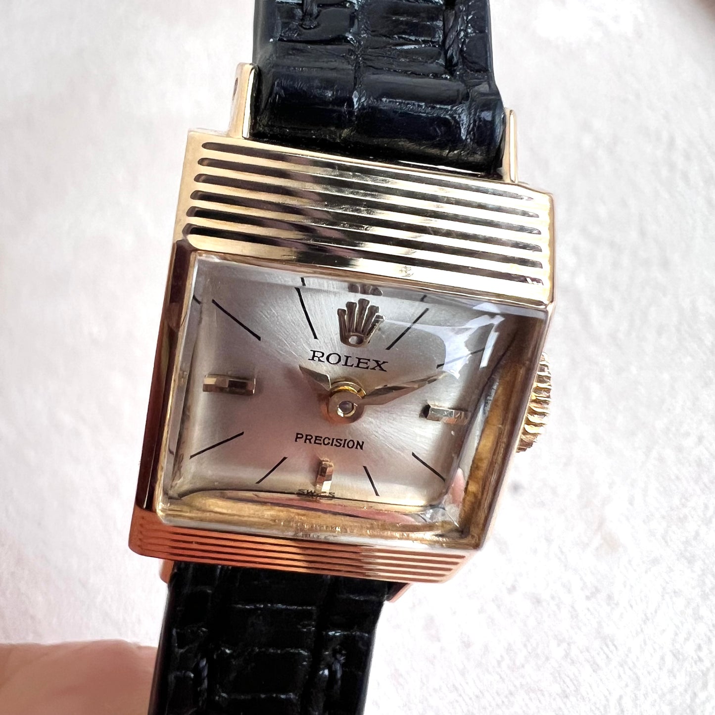 Rolex Precision 18k, step cut case w/ black strap