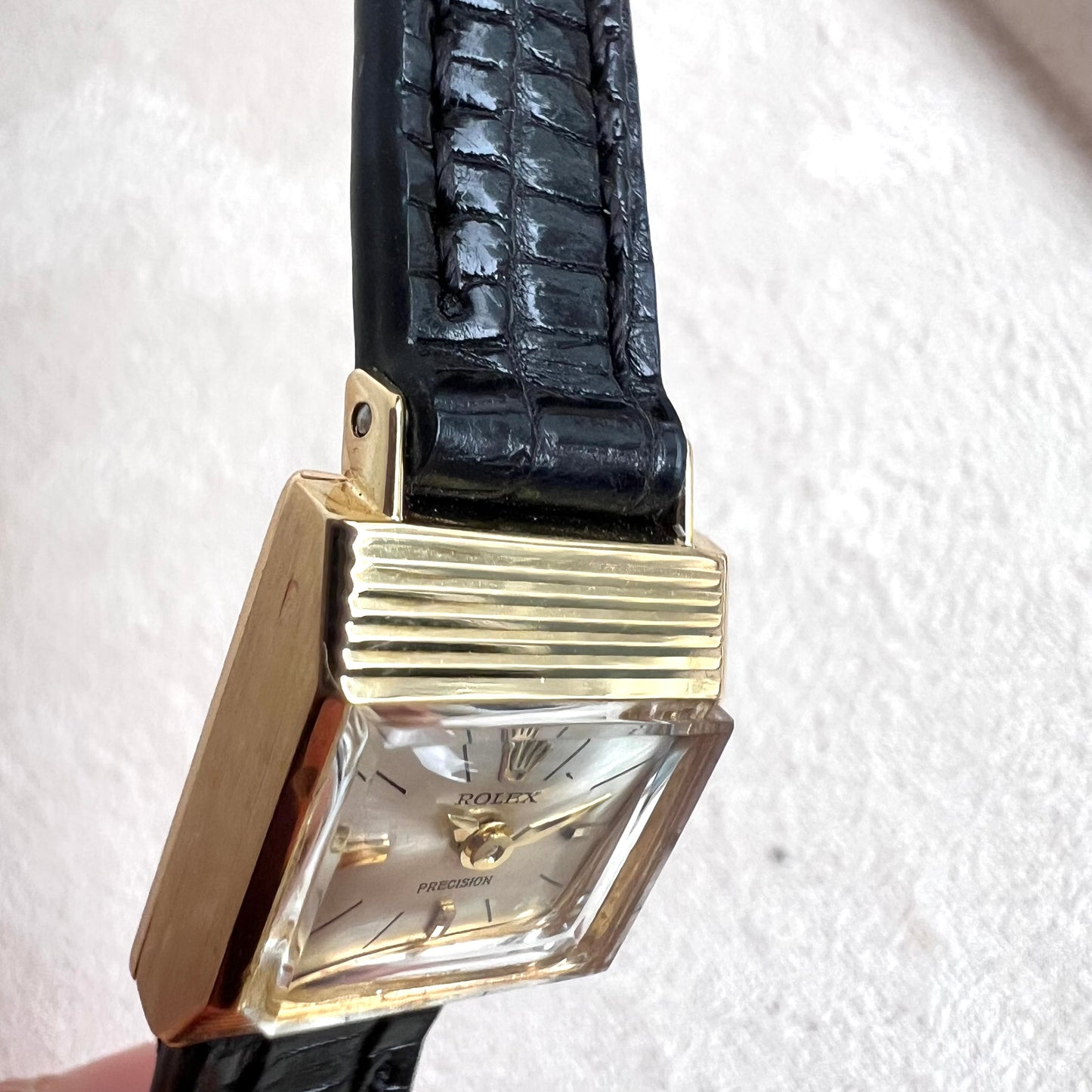 Rolex Precision 18k, step cut case w/ black strap
