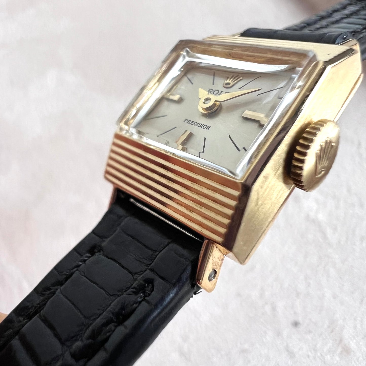 Rolex Precision 18k, step cut case w/ black strap