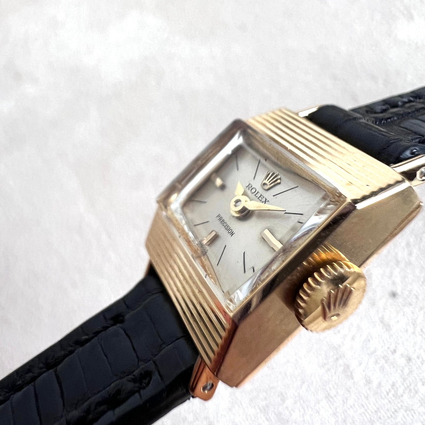 Rolex Precision 18k, step cut case w/ black strap